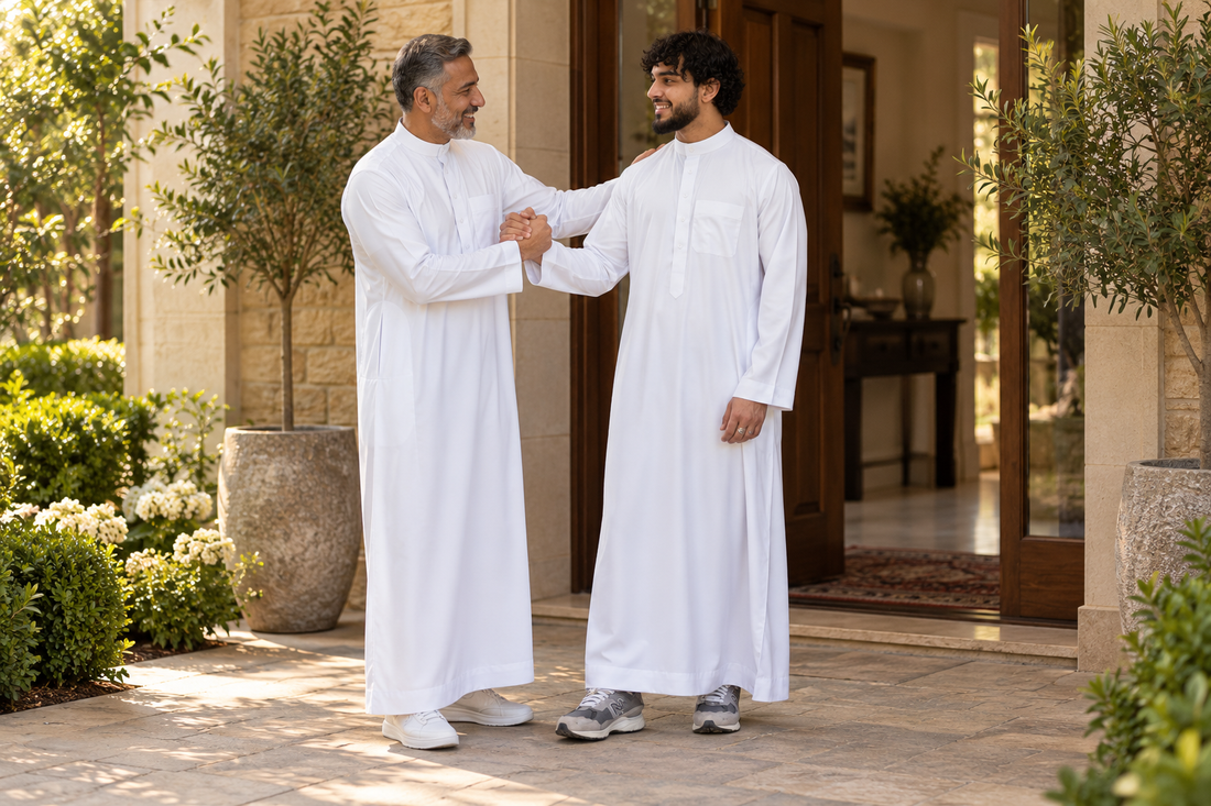 Silky Collared Thobe styling in White, worn by adults in a courtyard