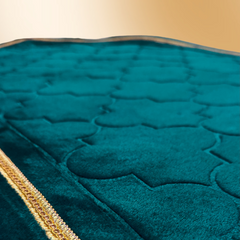 Green mihrab prayer mat surface and border detail