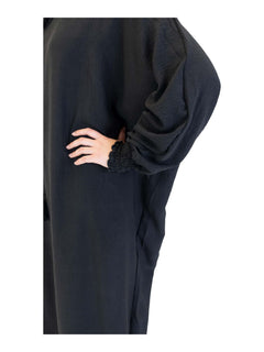 Black Urban hooded abaya on a model - elasticated cuff detail