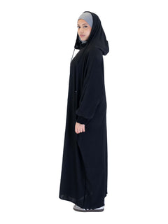 Black Urban hooded abaya on a model - three-quarter view with the hood down