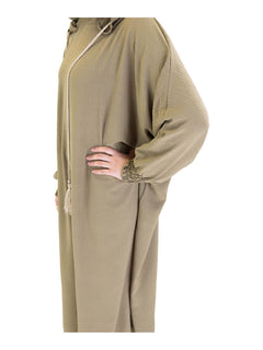 Green Urban hooded abaya on a model - elasticated cuff and neckline detail