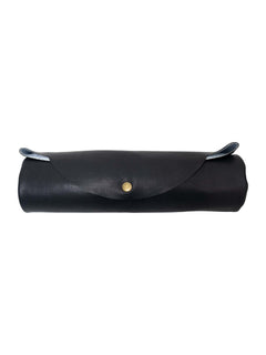 Black faux-leather travel prayer mat rolled for storage