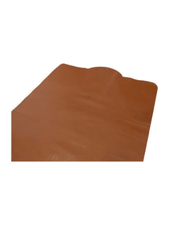 Brown faux-leather prayer mat surface detail