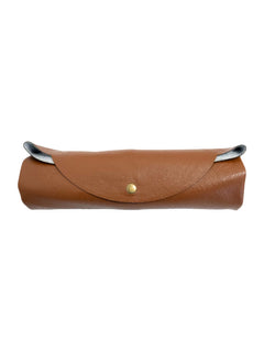 Brown faux-leather travel prayer mat rolled for storage