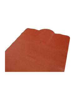 Orange faux-leather prayer mat surface detail