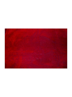Red plain velvet prayer mat surface detail