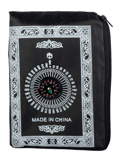 Black travel prayer mat folded into its compass pouch