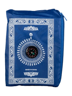 Blue travel prayer mat folded into its compass pouch