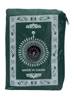 Dark green travel prayer mat folded into its compass pouch