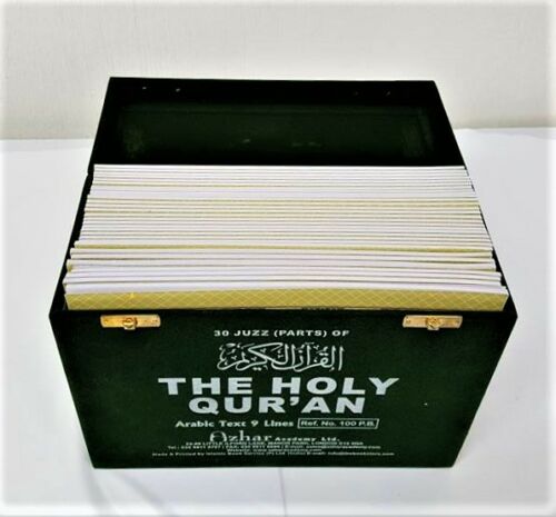 Green velvet Qur'an box open with 30 individual Juz volumes