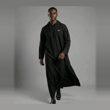 Man wearing a black thobe representing the Men's Attire collection