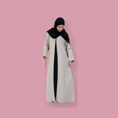 Woman wearing a modest abaya representing the Women's collection