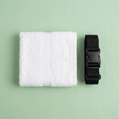 Folded white Ihram cloth and belt representing the Worship and Servitude collection