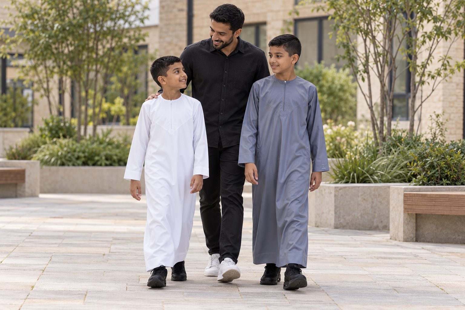Two boys styling the White and Grey Silky Thobes with trainers on a family walk