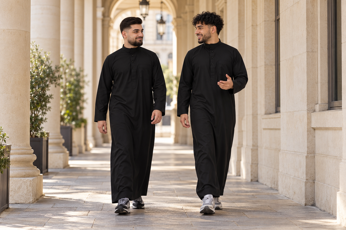Collared Thobe styling in Black, worn by adults in a courtyard